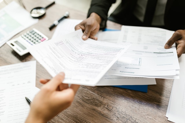 a%20person%20looking%20over%20various%20tax%20forms a%20person%20looking%20over%20various%20tax%20forms